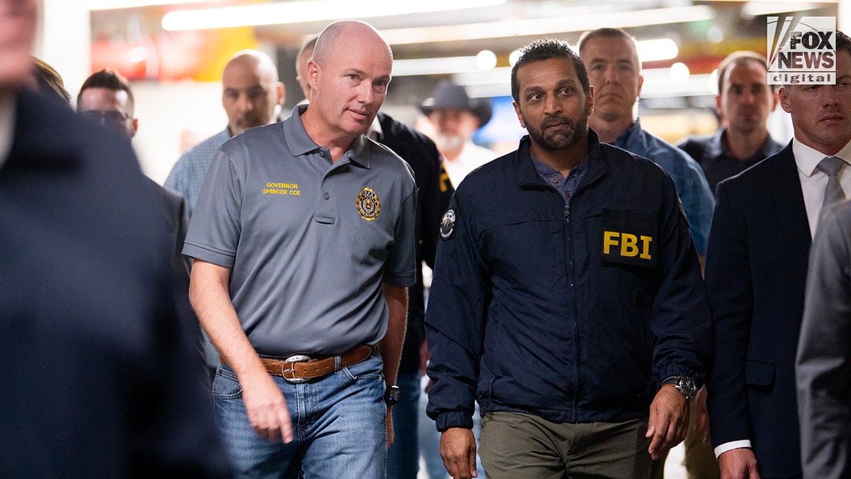 Utah Governor Spencer Cox and FBI Director Kash Patel arrive at a press conference to discuss new details in the investigation of Charlie Kirk's assassination