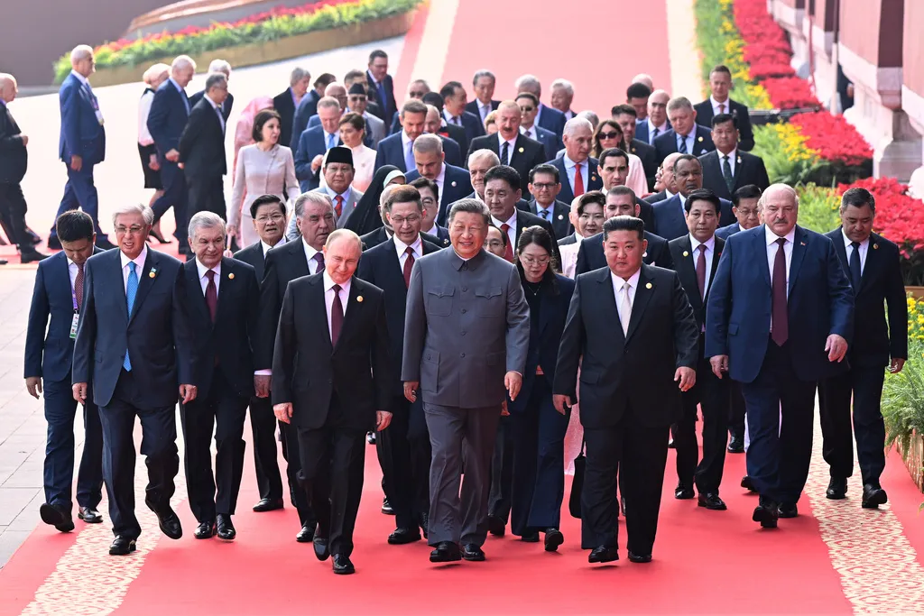 Chinese President Xi Jinping and foreign leaders including Russian President Vladimir Putin and North Korean leader Kim Jong Un walk to Tiananmen Rostrum.