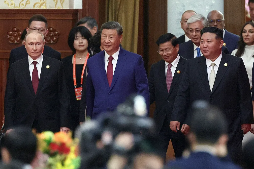 Russian President Vladimir Putin, Chinese President Xi Jinping, and North Korean leader Kim Jong Un arrive at a reception.