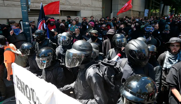 Multiple groups, including Rose City Antifa, the Proud Boys and conservative activist Haley Adams protest in downtown Portland, Ore., Saturday, June 29, 2019.