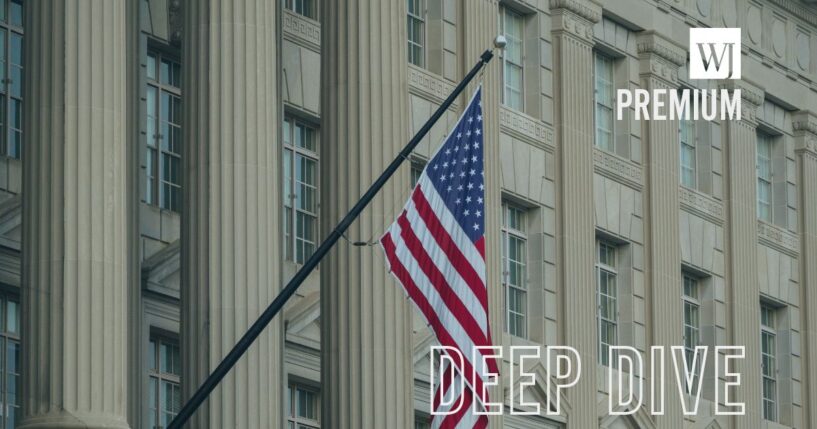 An American flag hangs outside of the U.S. Department of Commerce at the Herbert C. Hoover Federal Building on June 9, 2025, in Washington, D.C.