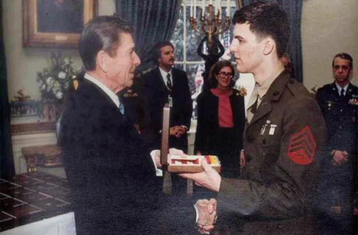 President Ronald Reagan (left) greets Kevin Hermening, and others who were held as hostages in Iran for 444 days, in January 1981 at the White House. (White House Photo via AP)