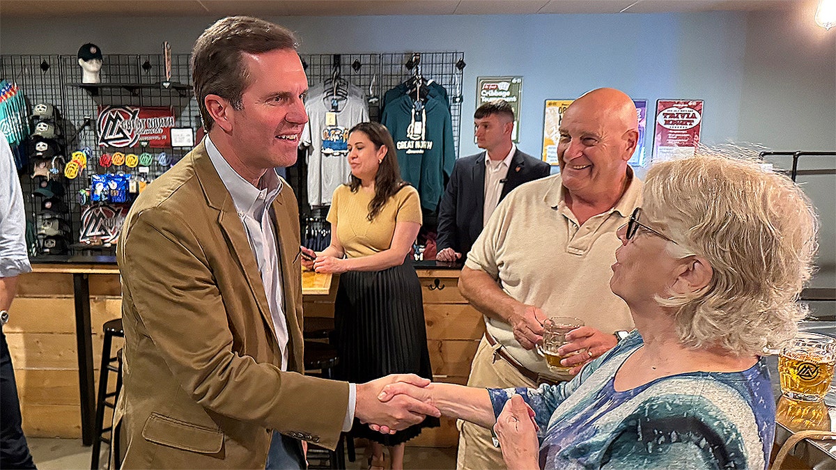 Andy Beshear greets Democratic activists