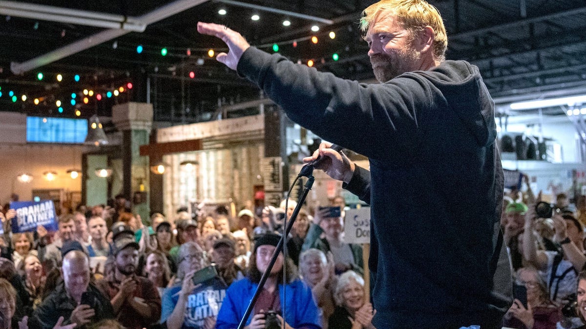 U.S. Senate candidate Graham Platner, D-Maine, acknowledges a large crowd in Portland, Me.