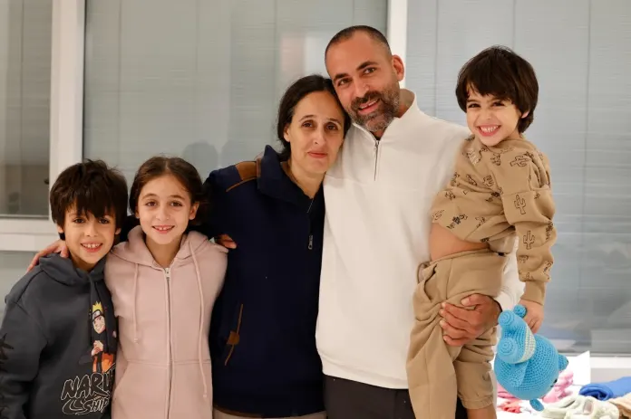 Avichai Brodutch is reunited with his wife and three children on November 26, 2023, after they were held hostage by Hamas for 51 days. 