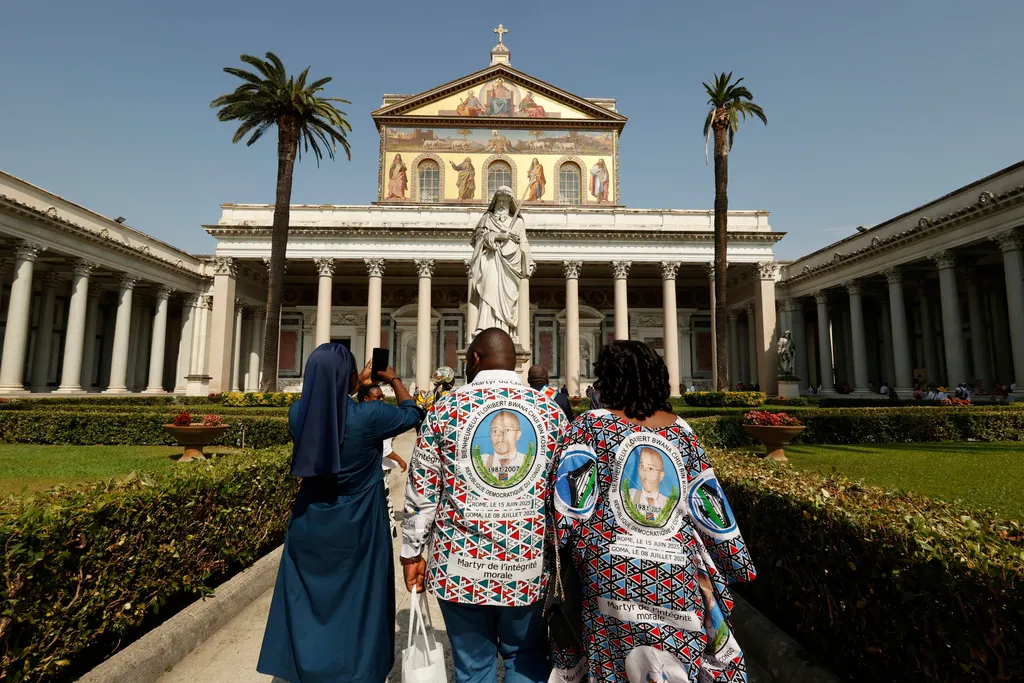 Faithful arrive for the beatification ceremony of Floribert Bwana Chui Bin Kositi, a Congolese man killed in 2007 for fighting corruption.