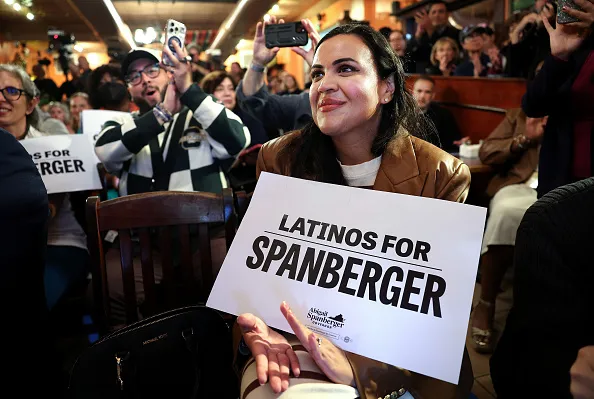 ALEXANDRIA, VIRGINIA - OCTOBER 30: An audience members listens as Virginia Democratic gubernatorial candidate, former Rep. Abigail Spanberger speaks during campaign event at Los Tios Grill on October 30, 2025 in Alexandria, Virginia. Spanberger will face off against Republican candidate Winsome Earle-Sears in the Commonwealth of Virginia’s off-year election for governor and other statewide offices on November 4.
