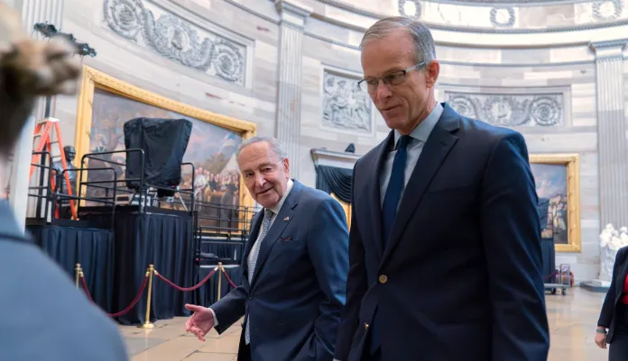 Senate Minority Leader Chuck Schumer, D-N.Y., left, and Senate Majority Leader John Thune, R-S.D., leads a Senate procession through the Rotunda to the House Chamber for a joint session of congress to confirm the Electoral College votes, at the Capitol on Monday, Jan. 6, 2025, in Washington. Walking behind her is Sen. Chuck Grassley R-Iowa.