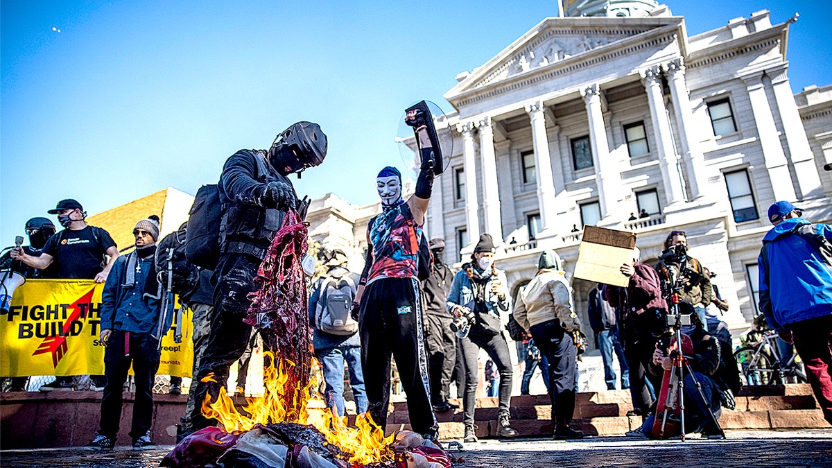Antifa, communists burning American flag