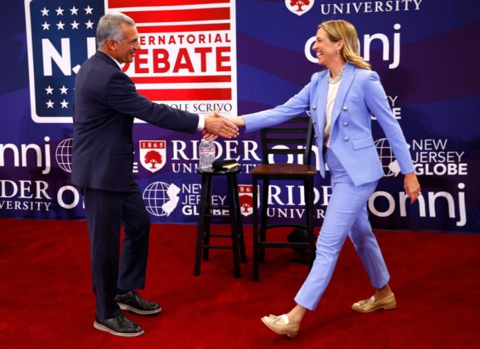 Republican nominee Jack Ciattarelli, left, shakes hands with Democratic nominee Mikie Sherrill, right