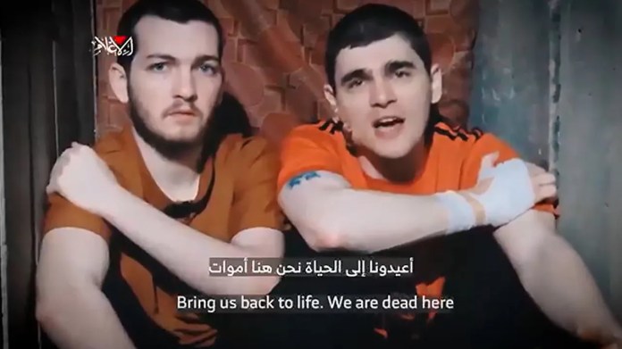 Bar Kuperstein, left, and Maxim Herkin seen in a Hamas propaganda video. ( Courtesy: Hostages’ Families Forum)