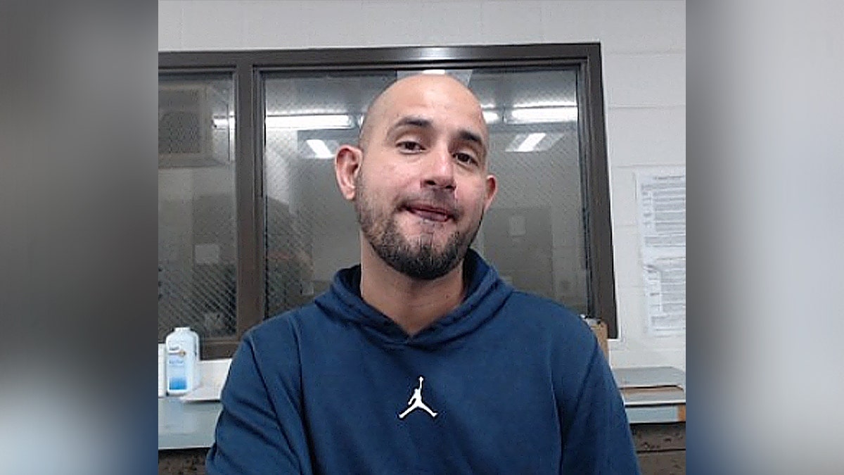 portrait of Dennis Mauricio Rojas-Molina in blue sweater