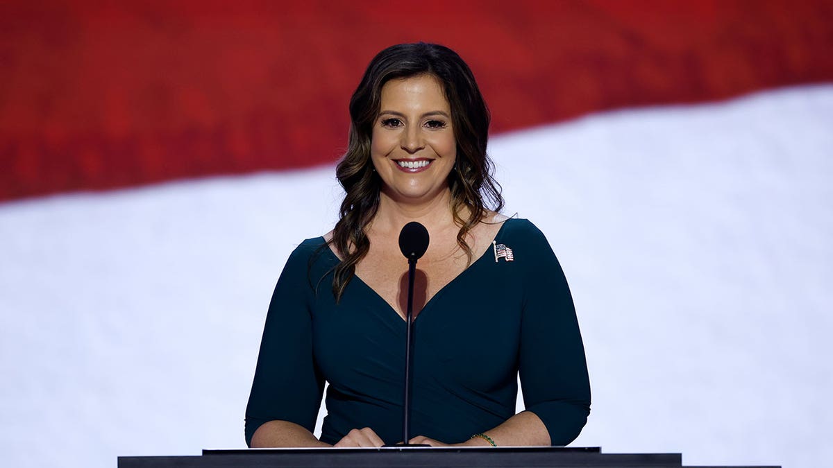 Rep. Elise Stefanik smiling at a podium