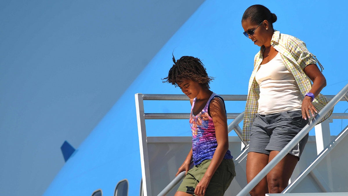 Then-first lady Michelle Obama departs Air Force One 