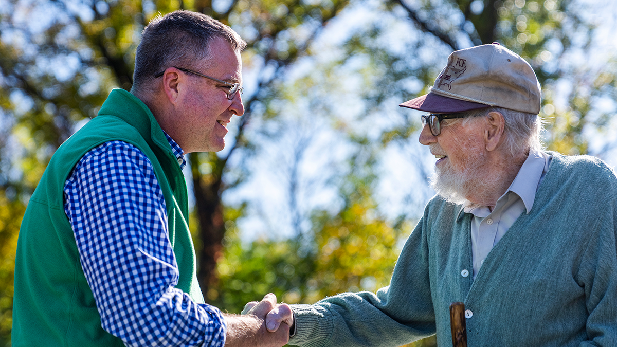Neil Parrott shakes hands with Roscoe Bartlett