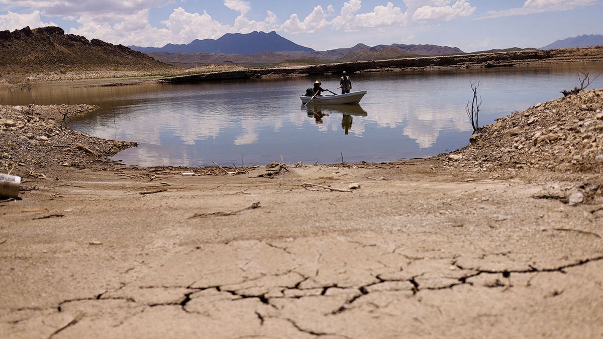 Boat in water surrounded by dry land.