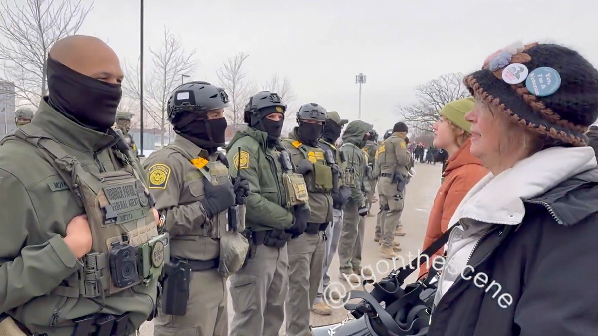 A Border Patrol agent chatted with a protester in Minnesota on Thursday, finding common ground over military service.