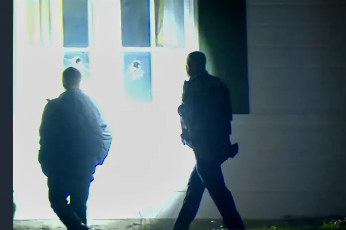 In this image taken from WCPO 9 News video shows officials inspecting broken windows and other property damage at Vice President JD Vance's Ohio home in eastern Cincinnati, Ohio, Monday, Jan. 5, 2026.