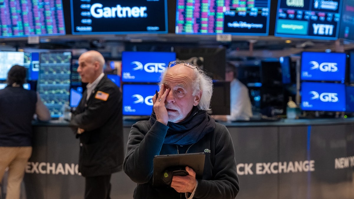 Traders work on the floor of the New York Stock Exchange (NYSE) on March 28, 2025, in New York City. As President Trump's escalating trade war and fresh signs of reinvigorated inflation concern investors, the Dow Jones Industrial Average (DJI) dropped more than 700 points or nearly 1.7%. (Photo by Spencer Platt/Getty Images)