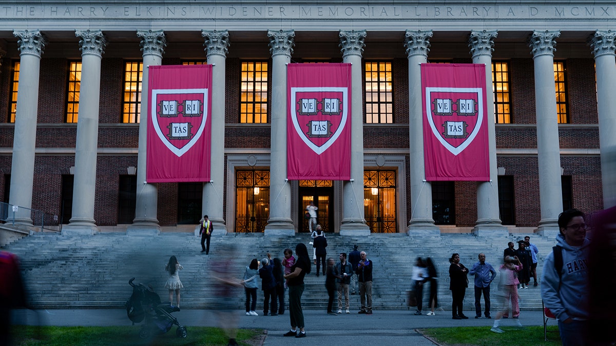 Harvard University banners hang in May 2025