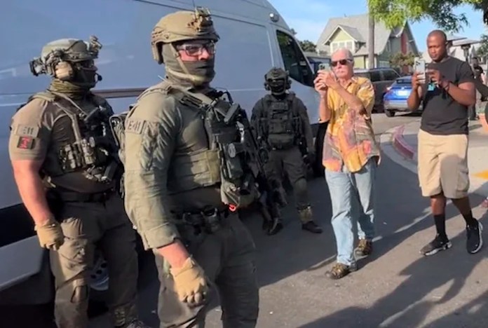 Immigration and Customs Enforcement agents execute a criminal search warrant.