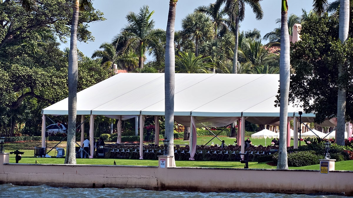 white tent is set up on the grounds of the Mar-a-Lago
