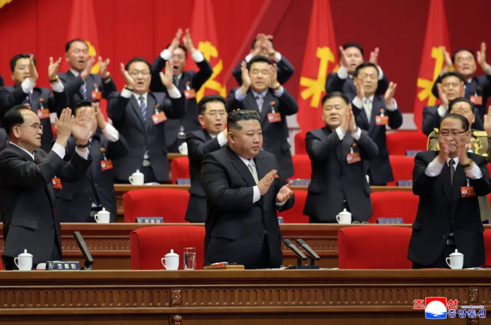 Kim Jong Un is applauded by members of the Workers' Party of Korea