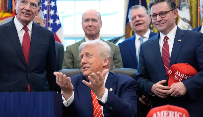 President Donald Trump speaks to reporters after signing a spending bill that ends a partial shutdown of the federal government in the Oval Office of the White House, Tuesday, Feb. 3, 2026, in Washington. (AP Photo/Alex Brandon)