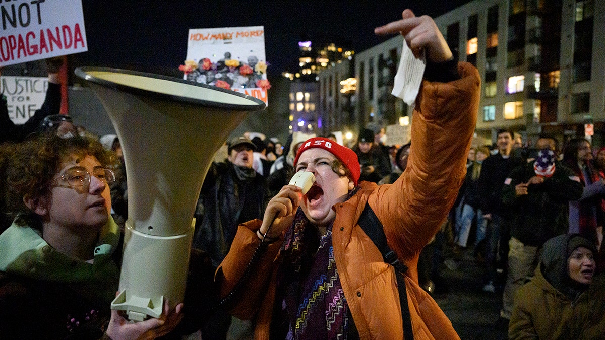 Woman yells into megaphone during protest at Portland ICE facility