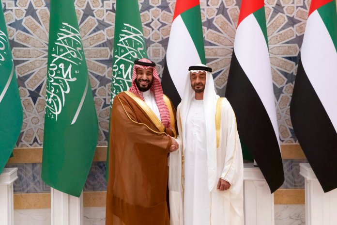 Crown Prince Mohammed bin Salman shakes hands with Crown Prince Mohammed bin Zayed Al Nahyan