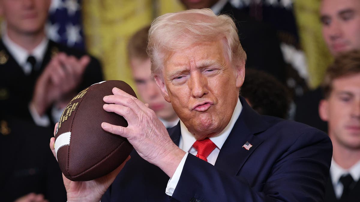 Donald Trump throws a football