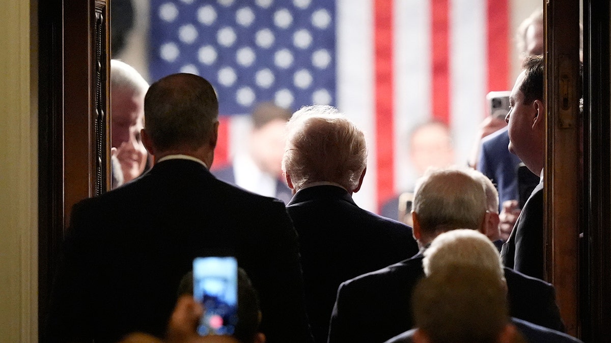 Donald Trump walking into the House chamber at the U.S. Capitol.