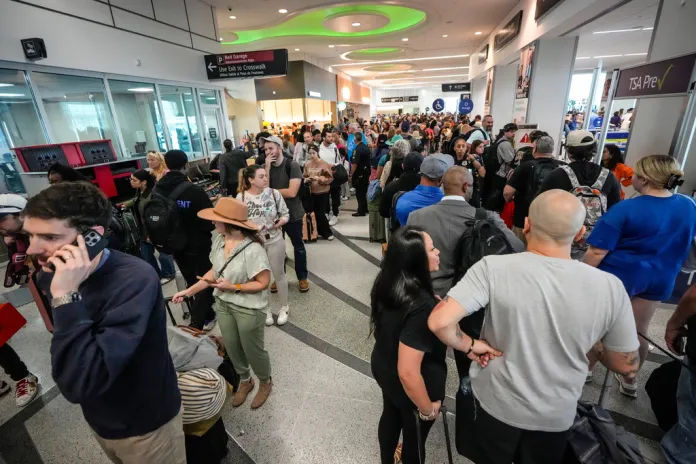 Airline passengers wait in long lines to get through the TSA security screening at William P. Hobby Airport in Houston, Sunday, March 8, 2026. (Brett Coomer/Houston Chronicle via AP)