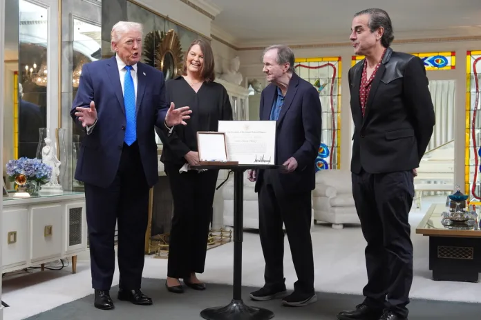 President Donald Trump speaks in the living room at Graceland, Elvis Presley's historic estate