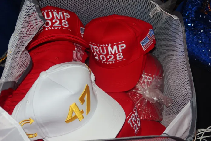 Sandy Schoepke, a conservative merchandise vendor, offers clients Trump 2028 hats for fre if they purchase two hats or spend $50. (Samantha-Jo Roth, Washington Examiner)
