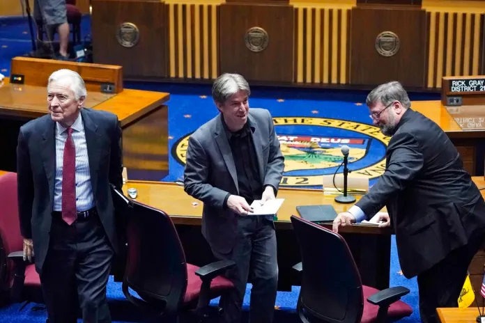 Cyber Ninjas CEO Doug Logan, center, Ben Cotton, right, founder of digital security firm CyFIR, and Randy Pullen