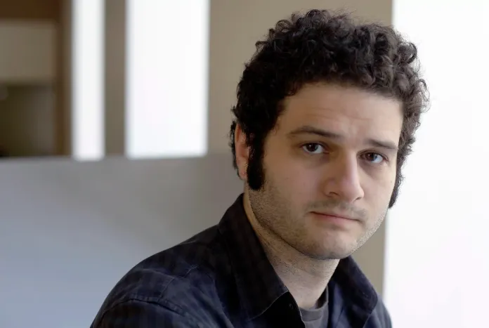 Dustin Moskovitz, a Facebook co-founder, poses outside of his office in San Francisco. Moskovitz says he is giving $20 million to help defeat Donald Trump, calling the Republican presidential candidate divisive and dangerous and his appeals to Americans who feel left behind "quite possibly a deliberate con." (AP Photo/Eric Risberg)