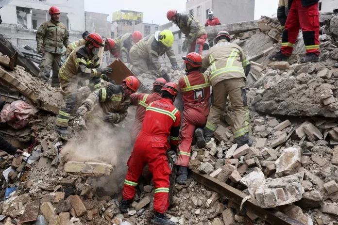 Iranian emergency responders search for survivors in Tehran