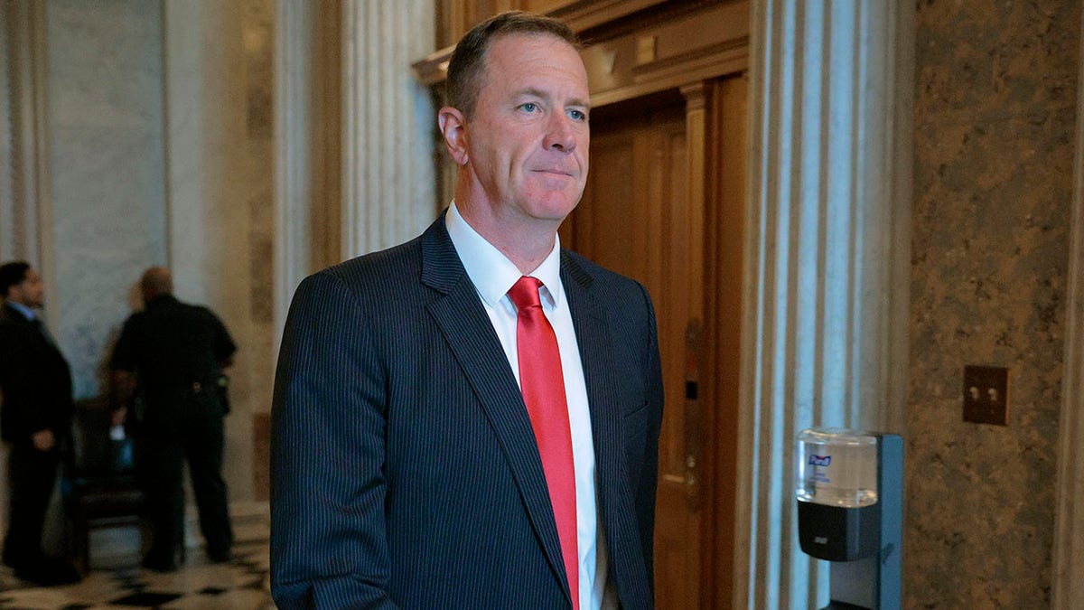 Sen. Eric Schmitt, R-Mo., walking from the Senate floor.