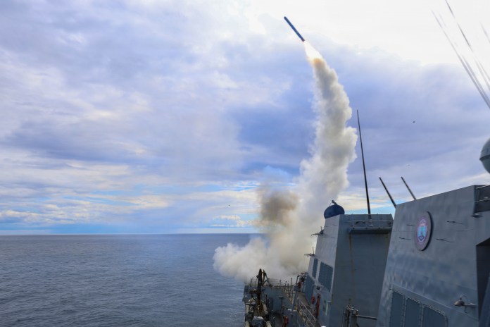 The Arleigh Burke-class guided-missile destroyer USS Thomas Hudner firing a Tomahawk Land Attack Missile.