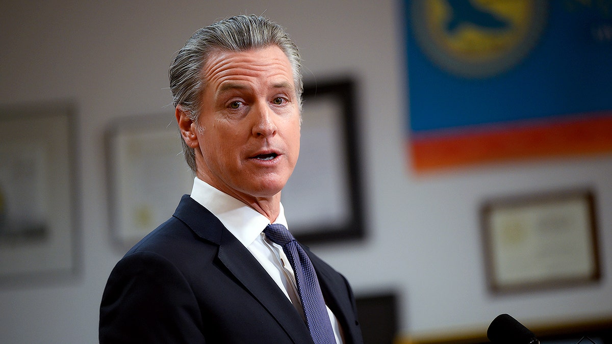 Gavin Newsom looks as he continues a potential campaign for president