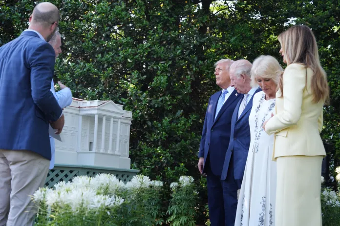 President Donald Trump and Britain's King Charles III look at the White House garden and bee hive on the South Lawn of the White House, Monday, April 27, 2026, in Washington.