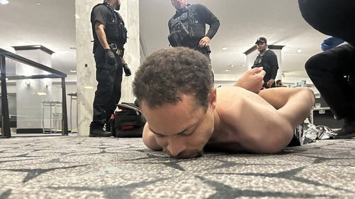 US President Donald Trump posting a photo of law enforcement detaining a suspect