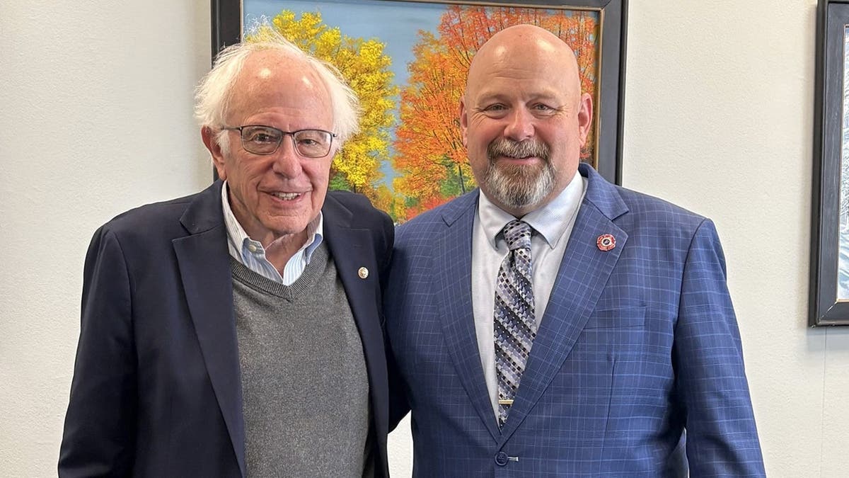 Bernie Sanders and Bob Brooks pose for a photo