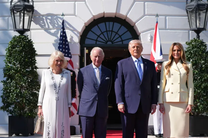 President Donald Trump and first lady Melania Trump greet King Charles III and Queen Camilla as they arrive at the White House, Monday, April 27, 2026, in Washington. 