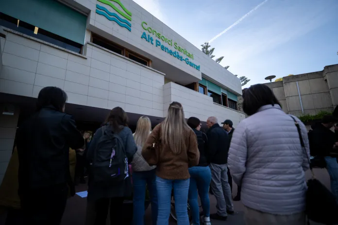People gather outside a hospital in Spain.