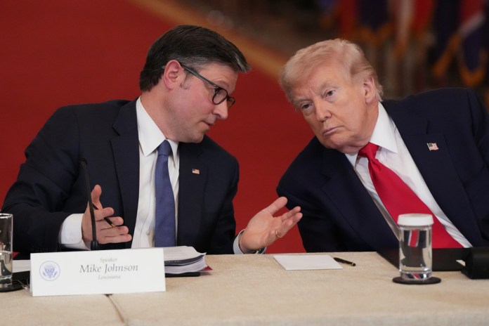 House Speaker Mike Johnson, left, speaks with President Donald Trump.