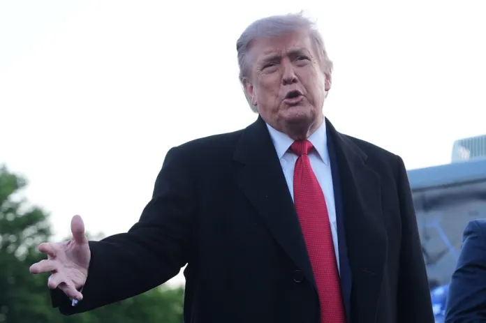 President Donald Trump speaks as he visits the Lincoln Memorial Reflecting Pool to see the new blue protective coating being applied as part of a renovation project, Thursday, May 7, 2026, in Washington. (AP Photo/Mark Schiefelbein)