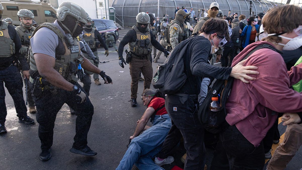 Federal immigration officers clashing with protesters outside Delaney Hall in Newark