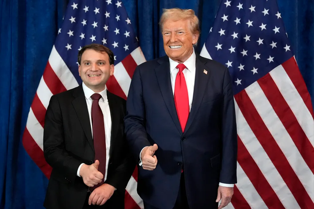 Republican presidential nominee Donald Trump poses for a photo with Wyoming Secretary of State candidate Chuck Gray